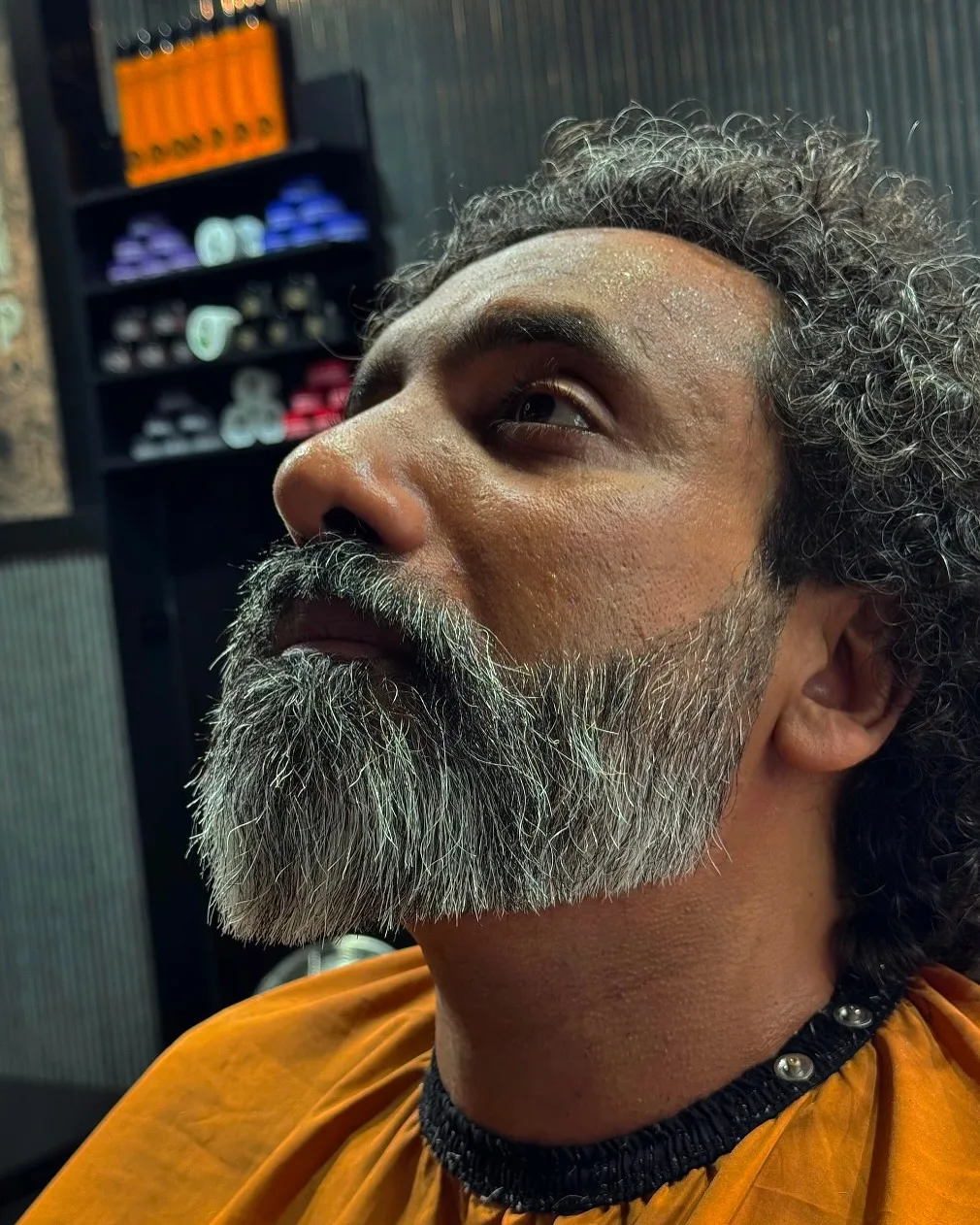 Salt and pepper curls with full grey beard