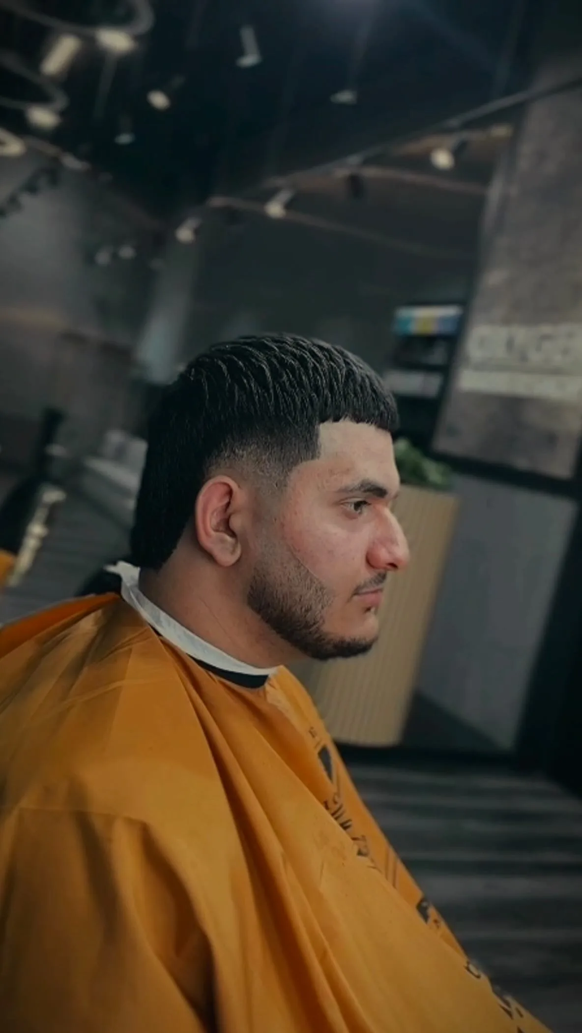 Textured mullet cut in moody low light